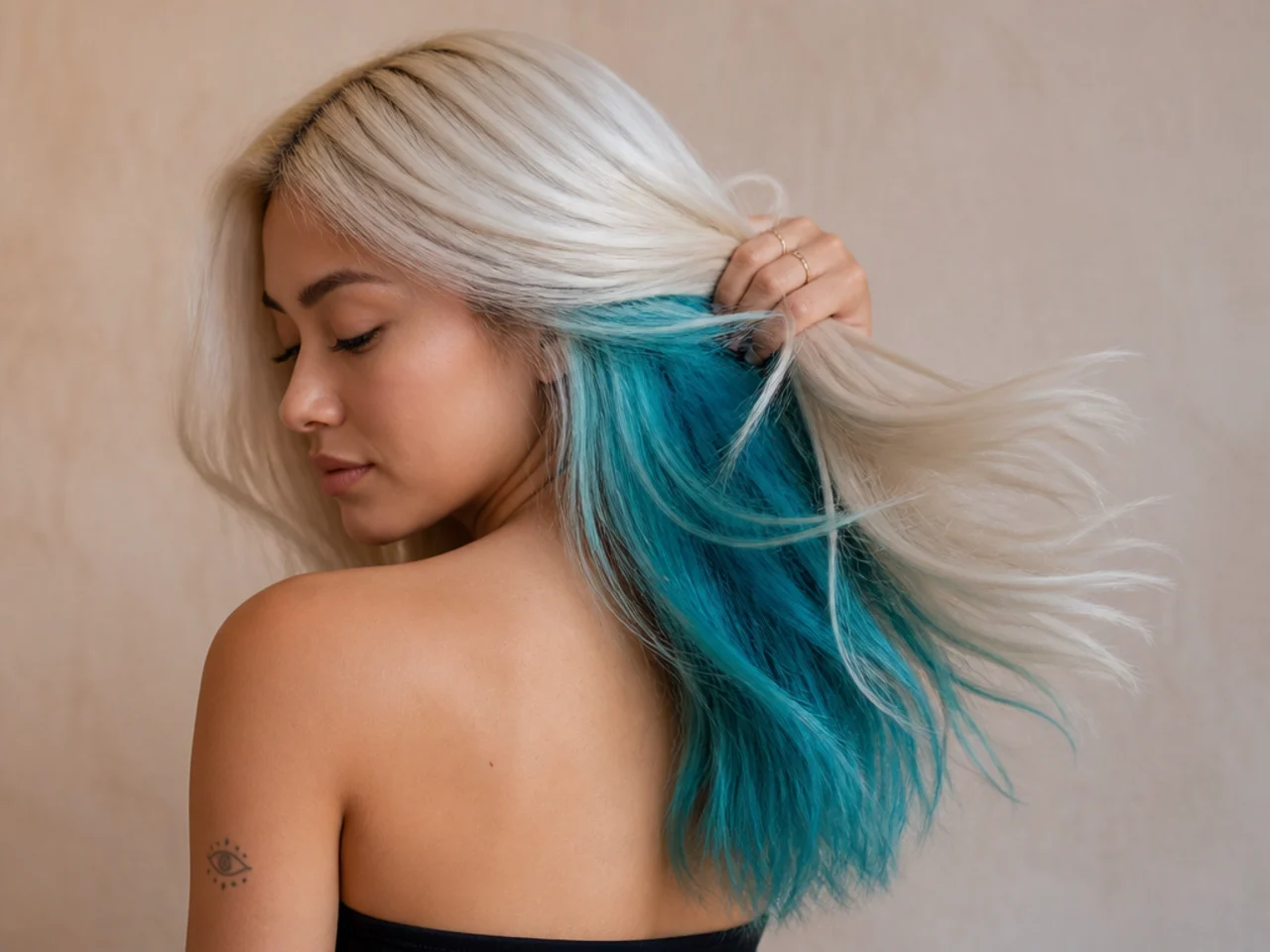 A turquoise panel under platinum hair