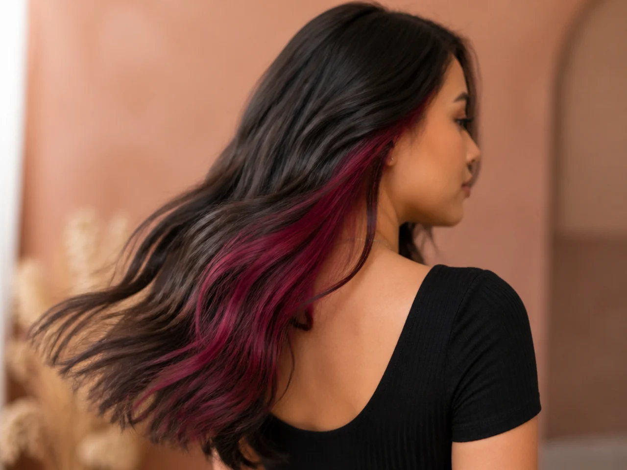 A magenta panel on brunette hair