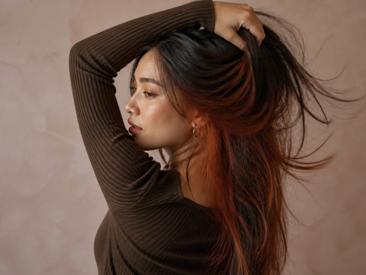 An auburn panel on brunette hair