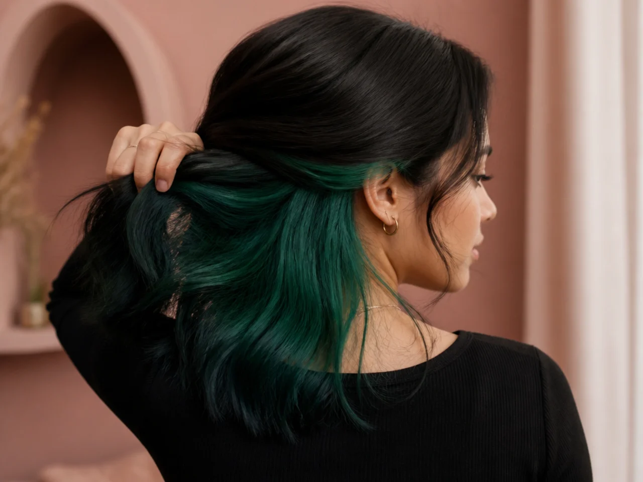 An emerald panel under black hair