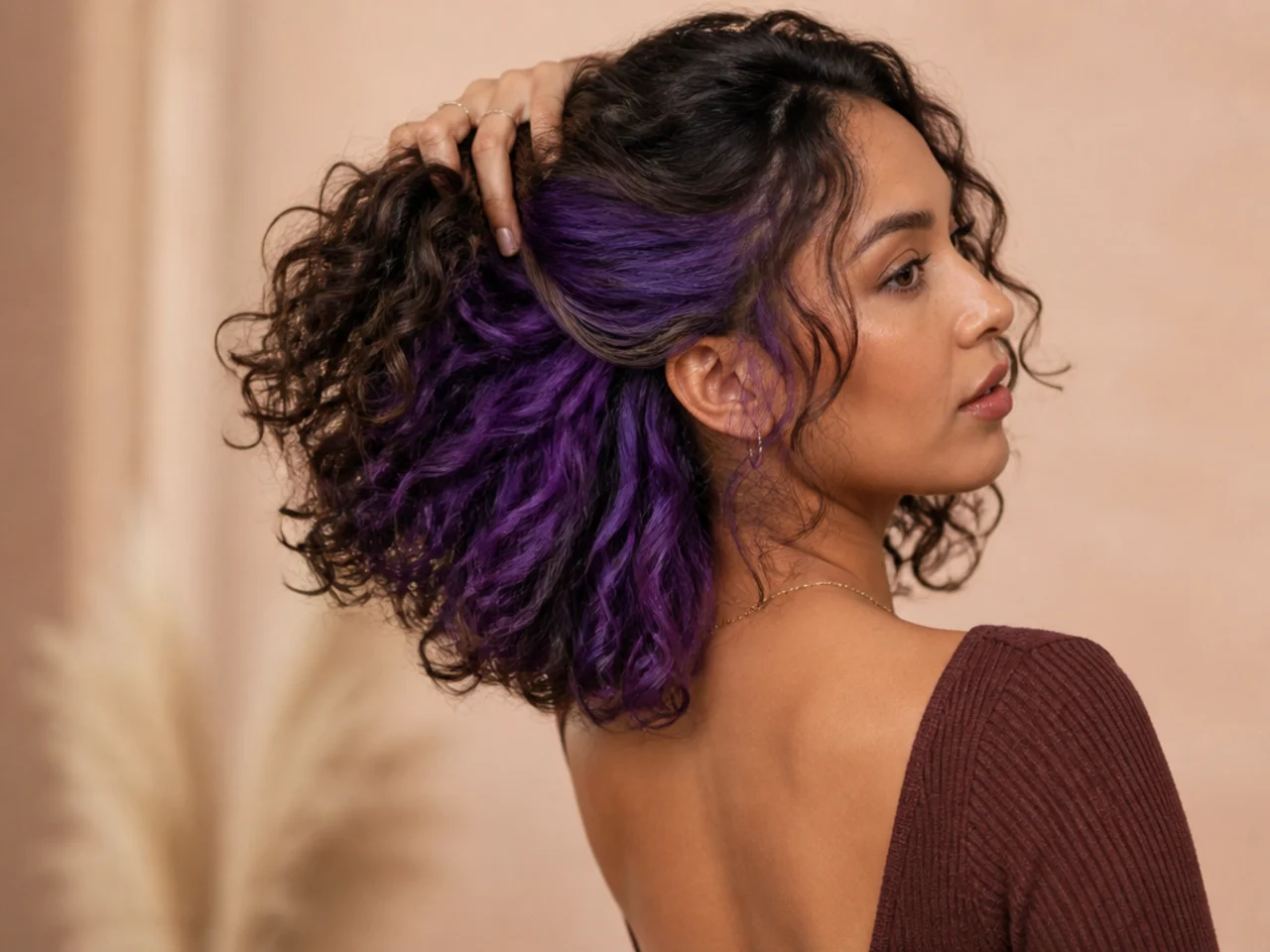 A purple panel on curly medium-length hair