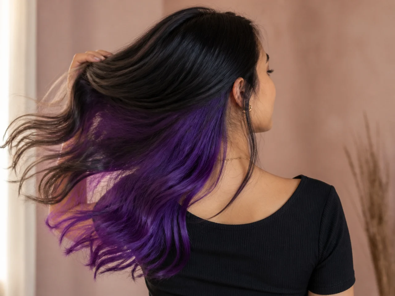 An electric purple panel under black hair