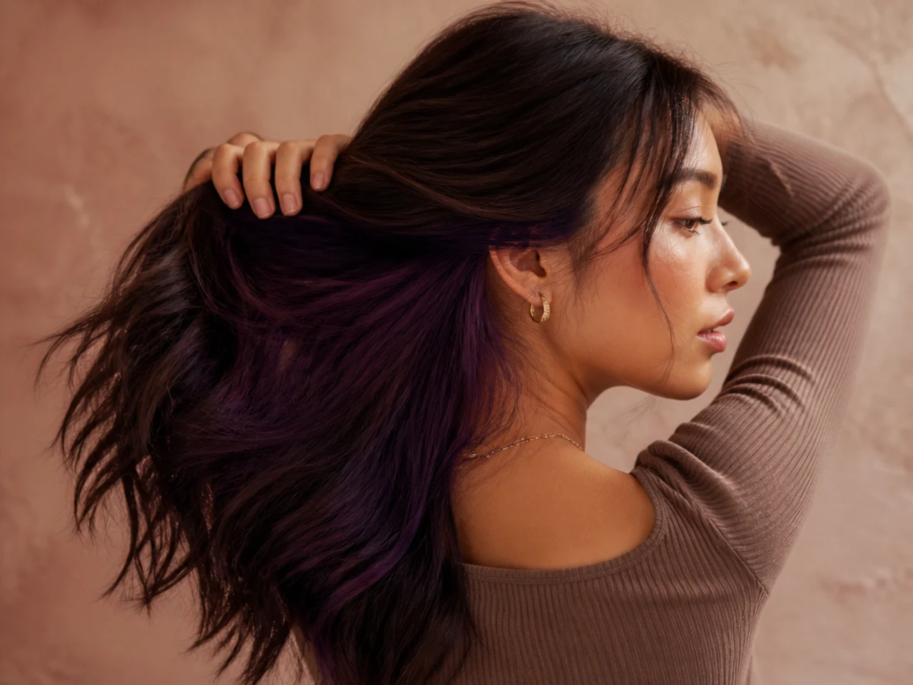 An aubergine panel under brunette hair