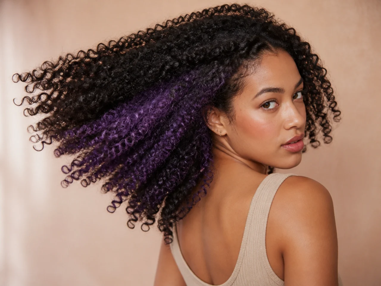A violet panel on coily hair