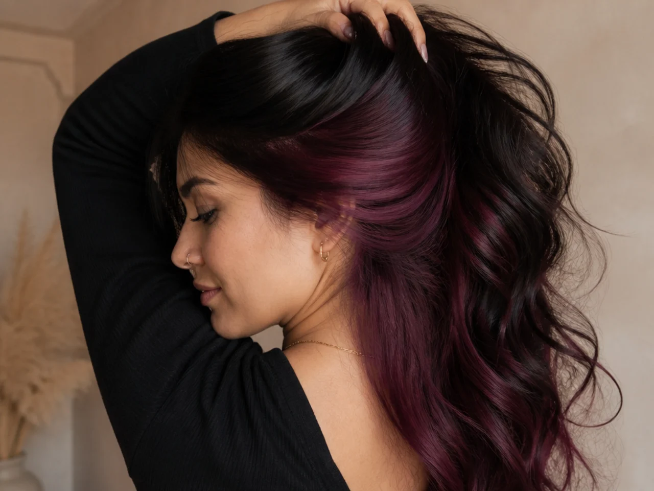 Deep plum panel under black hair