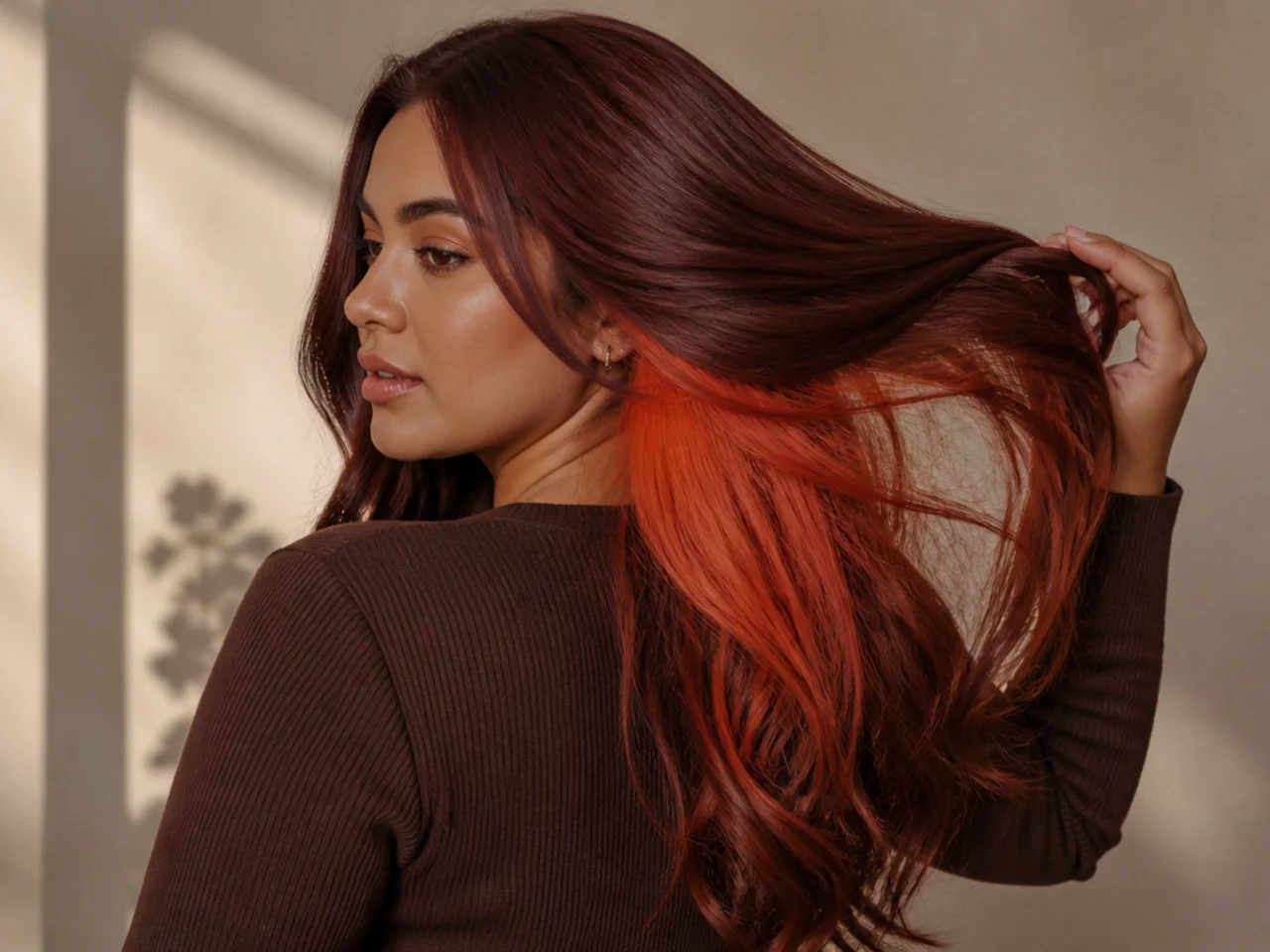 Orange panel under dark auburn hair
