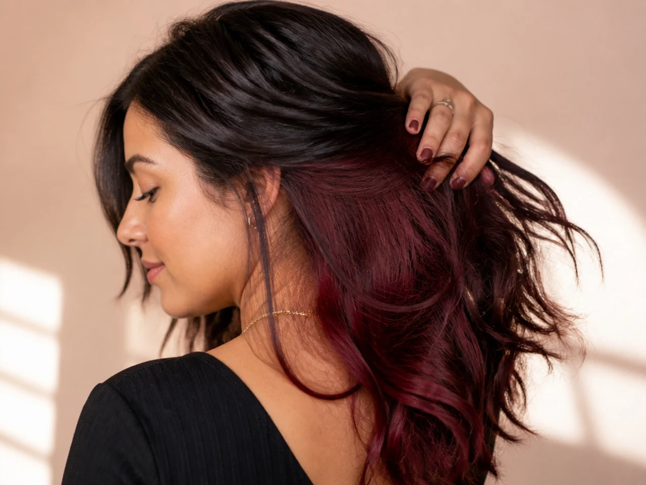 Burgundy panel under brunette hair