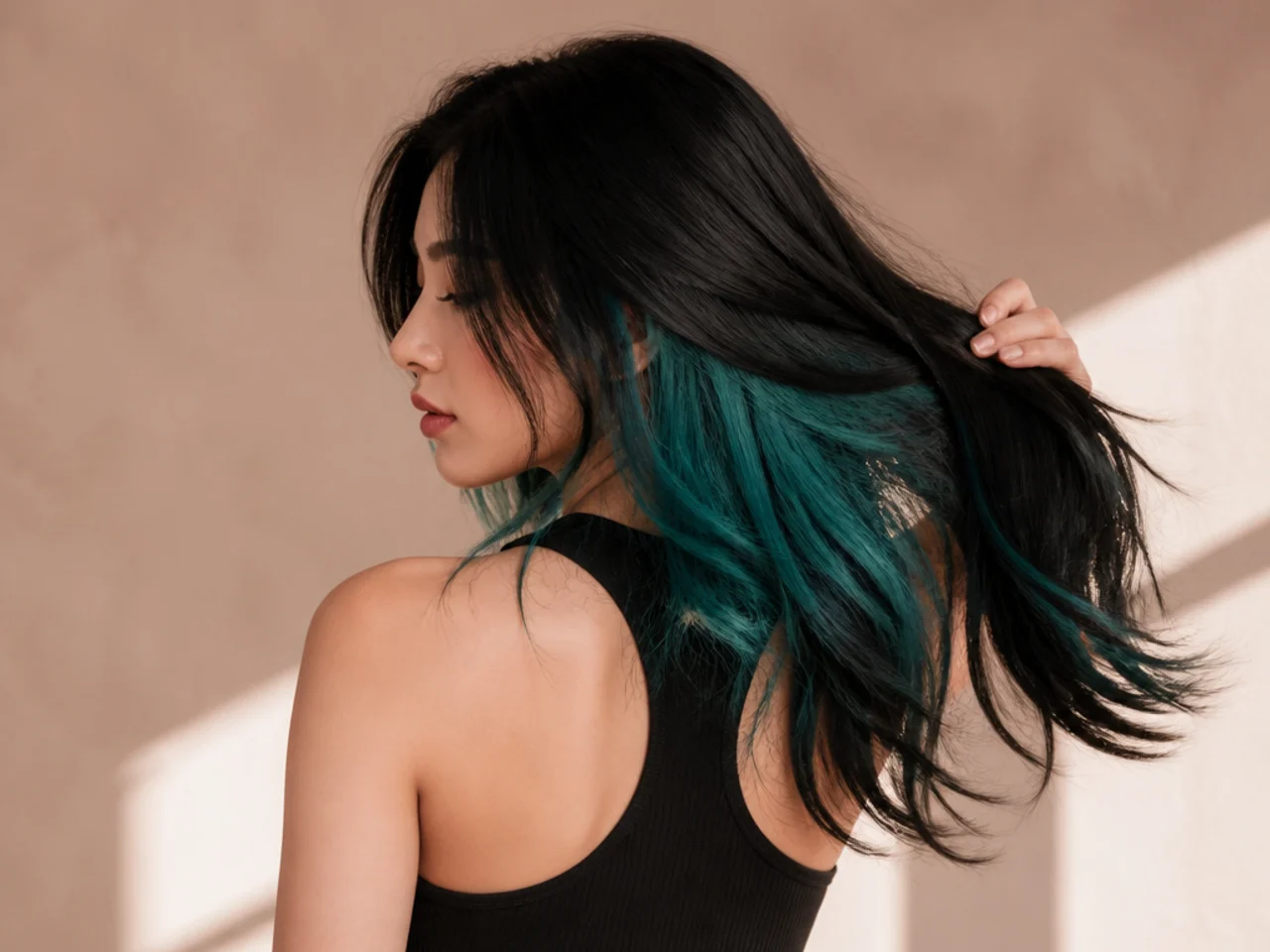 Teal panel under black hair
