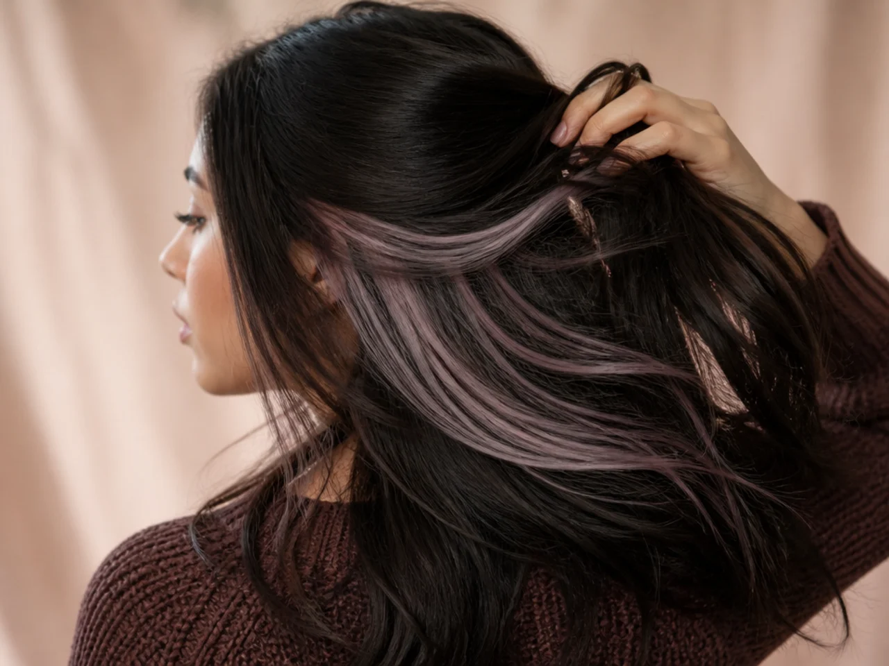 A pastel panel barely visible on unlifted dark hair