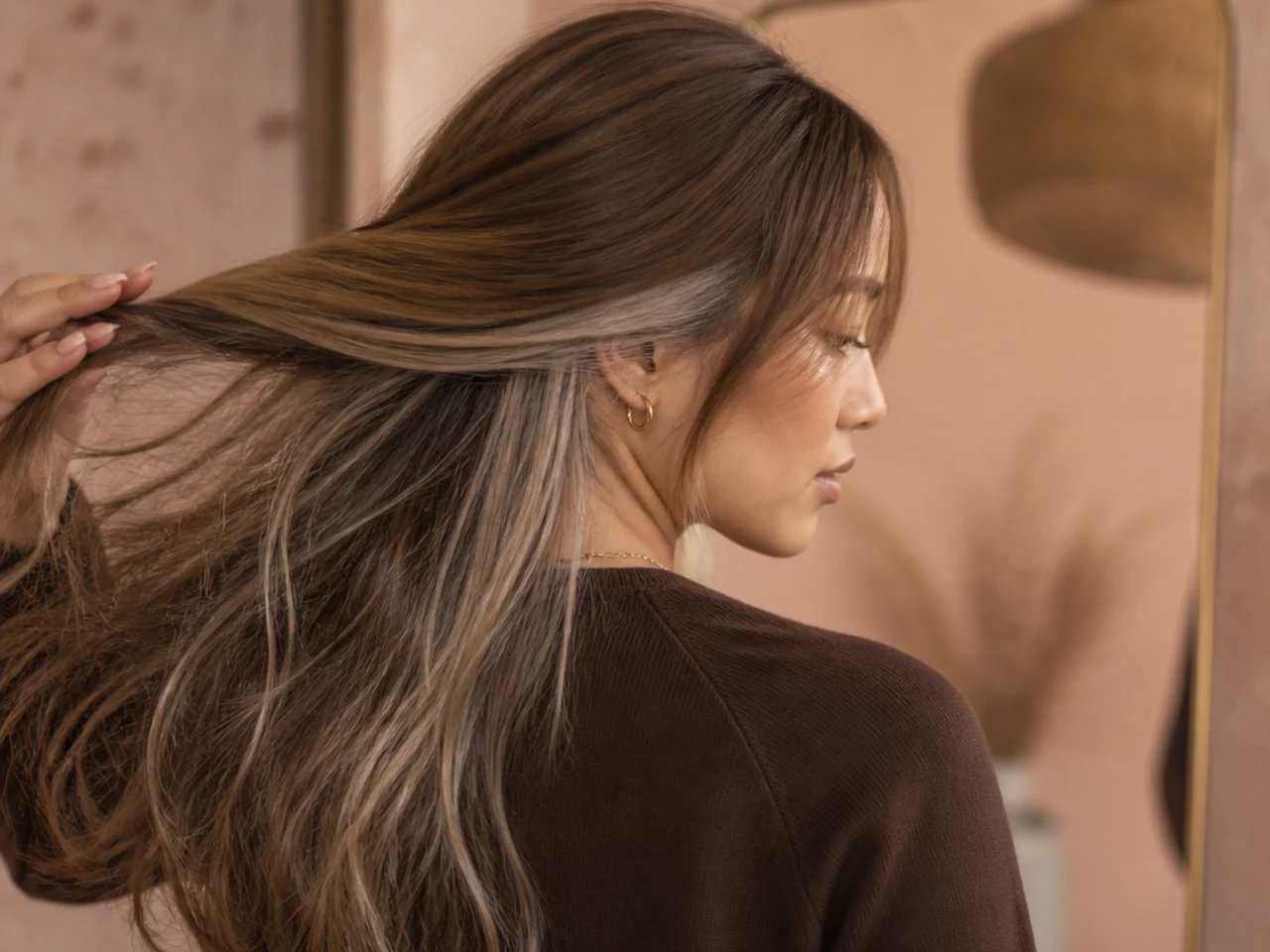 An ash blonde panel under light brown hair