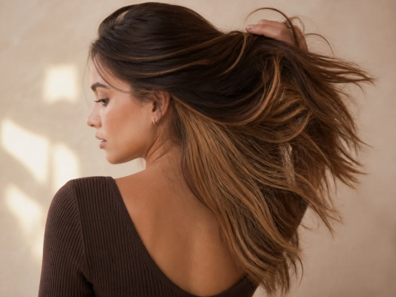 A golden panel under light brown hair