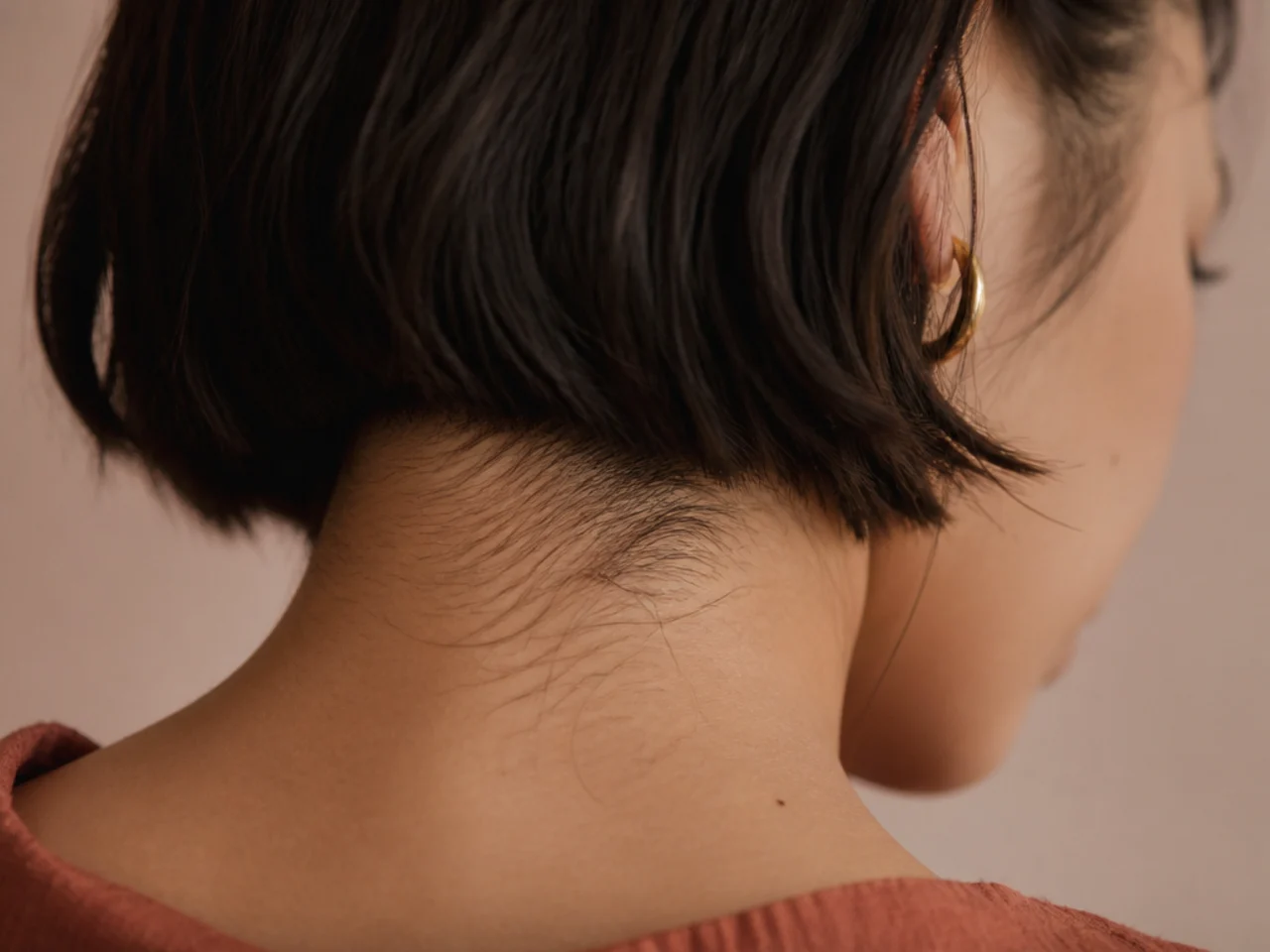Close view of fine nape hair beneath a short cut