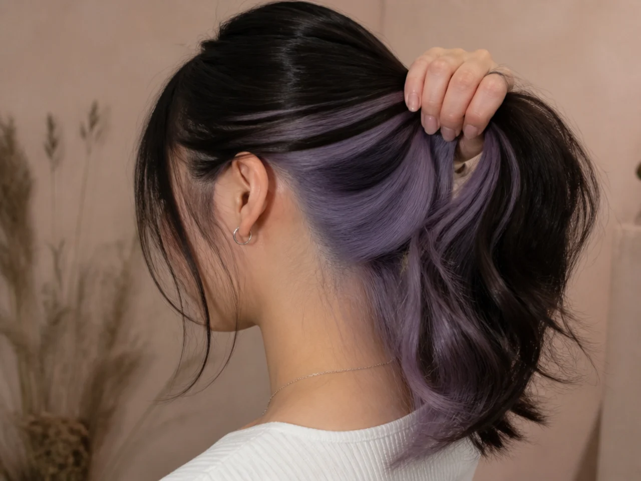 A pastel lilac underlayer on dark hair