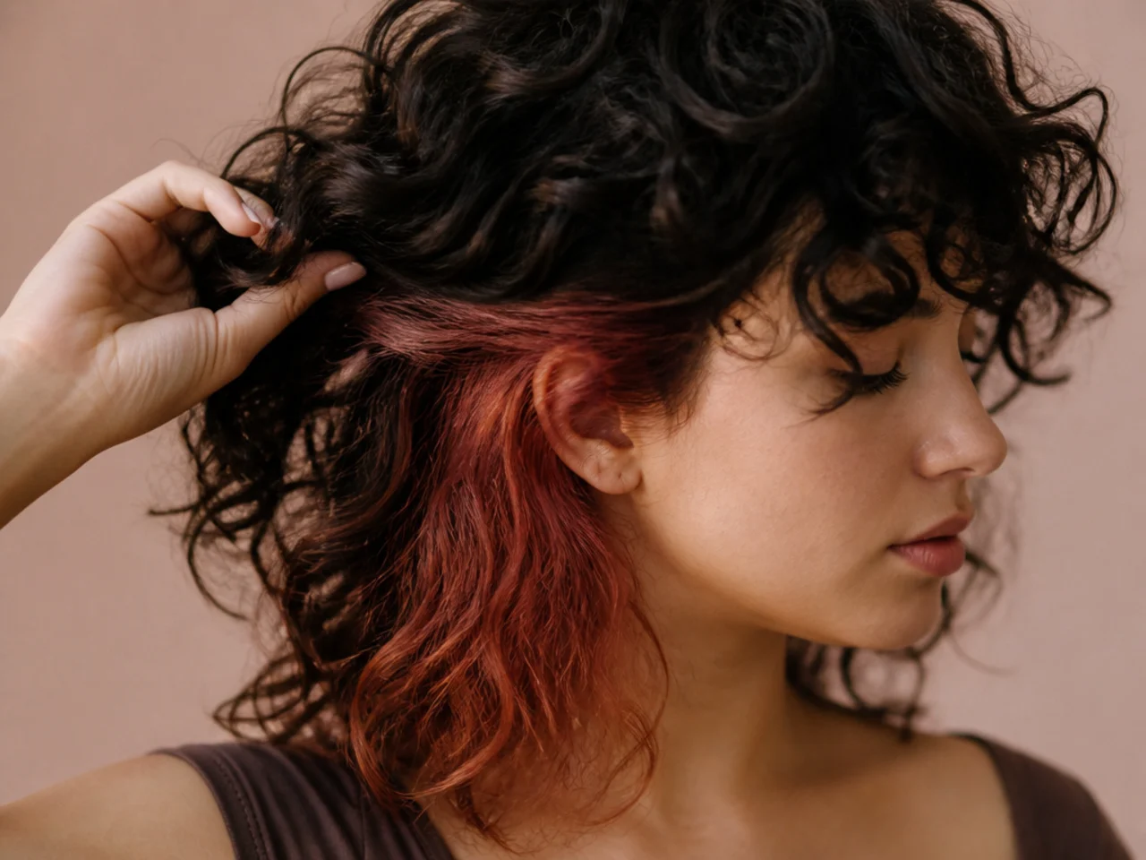 A colour panel under curly dark hair