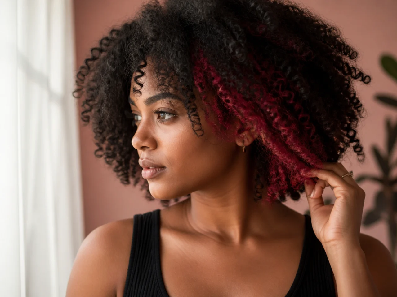 A coloured underlayer on coily dark hair