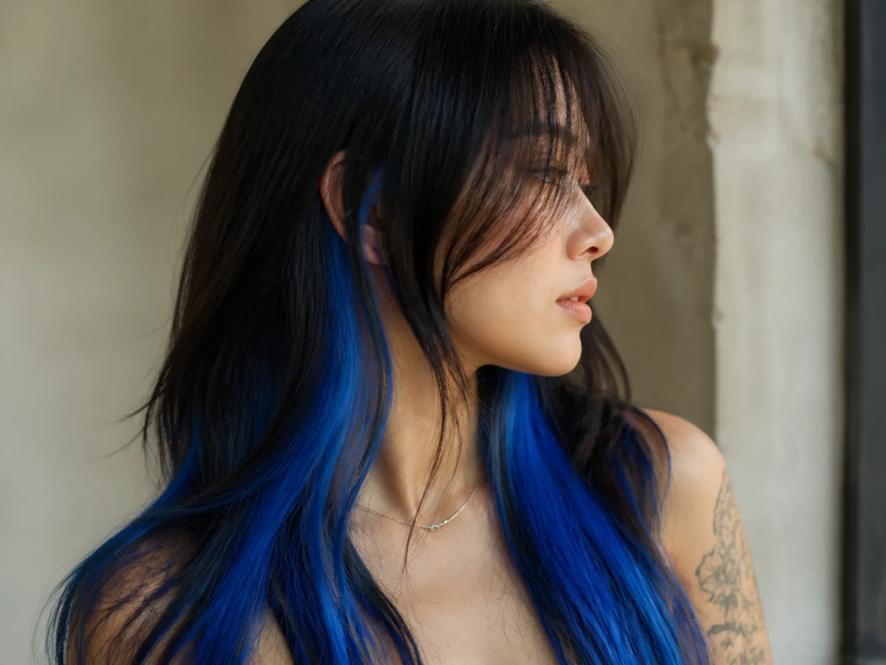 An electric blue underlayer on dark hair