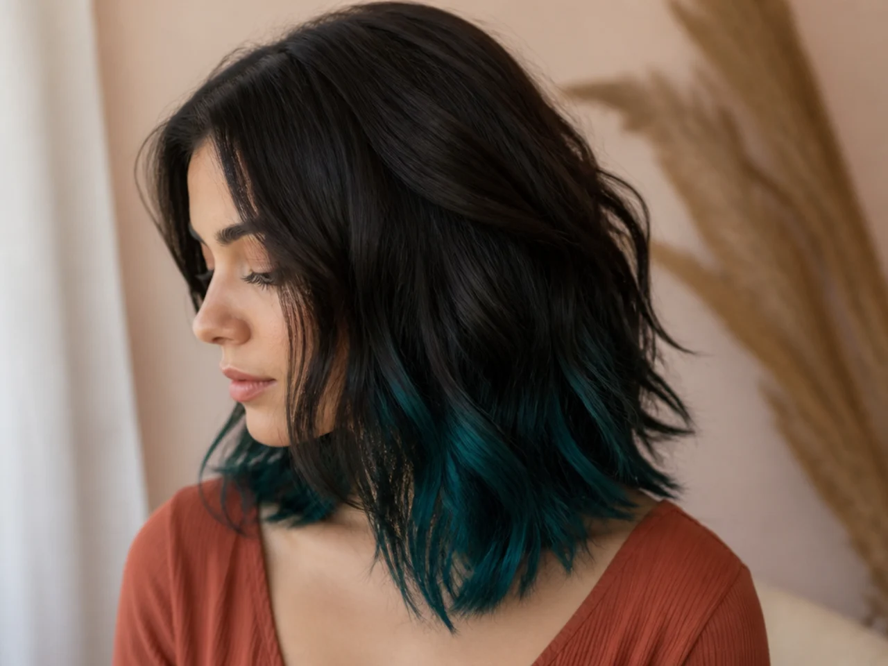 A teal panel under dark hair