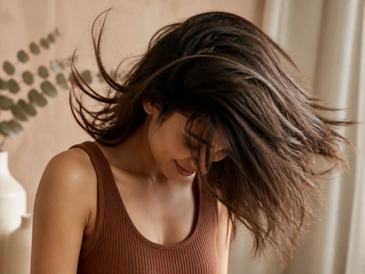 Hair flipped forward and shaken at the roots