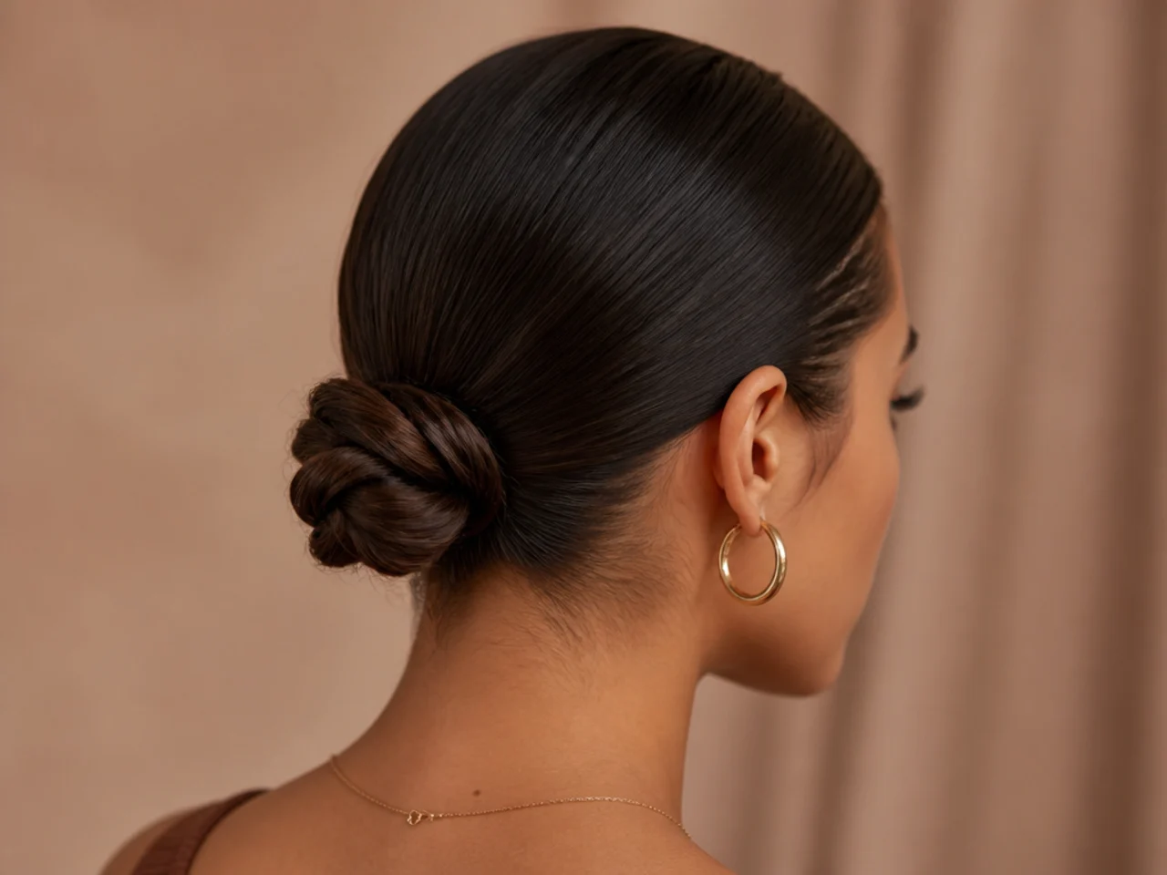 A short bun with slicked sides