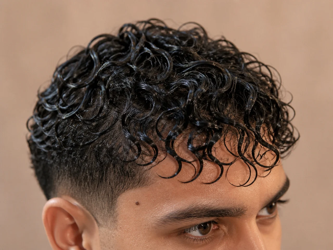 Wet curly hair stretched to its full length