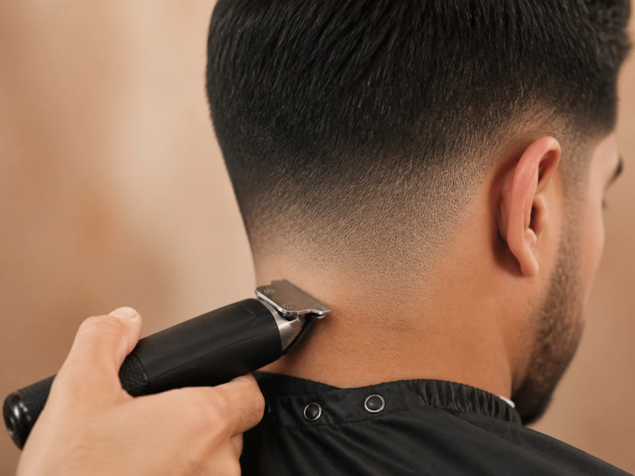 A neckline being tidied between full haircuts