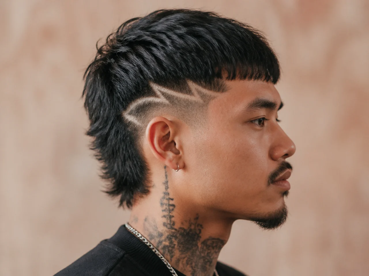 Short mullet with shaved design detail at the temple or side