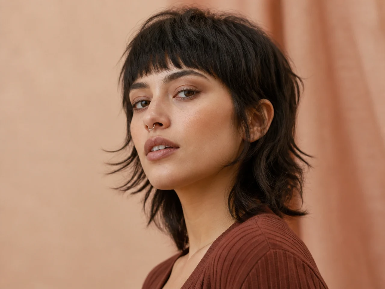 Short wolf cut with a blunt fringe