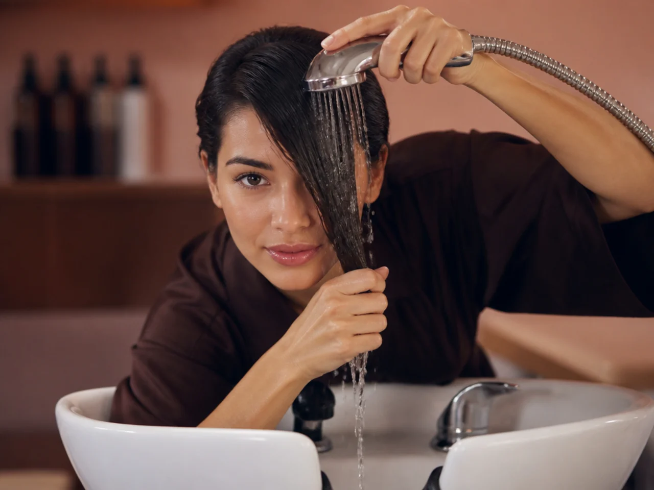 A fringe being washed alone at a sink