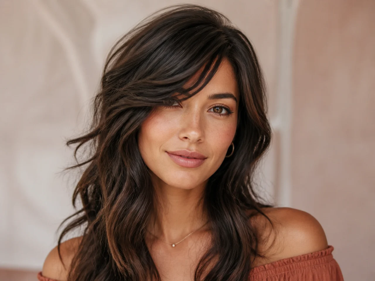Side swept bangs with layers on wavy hair