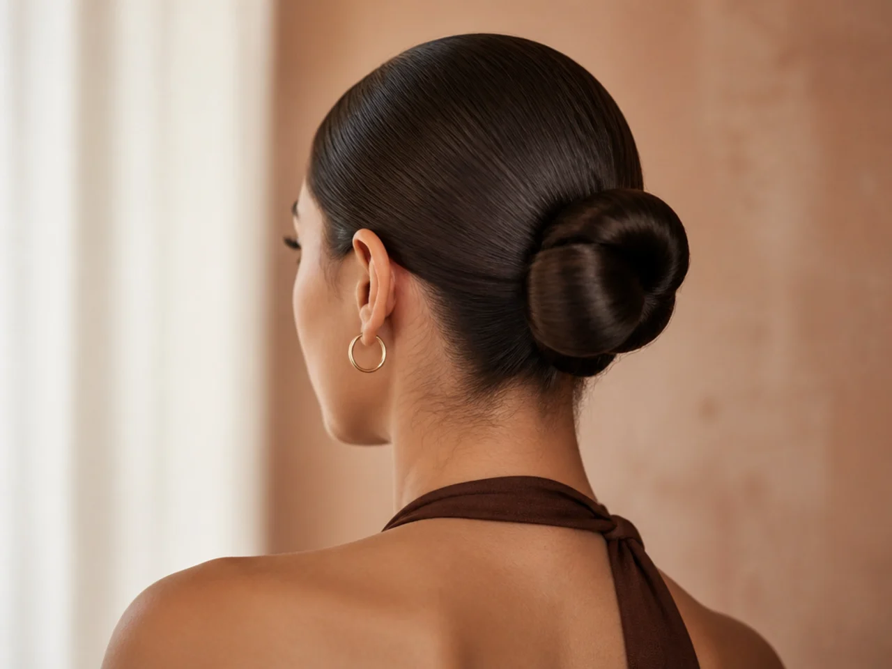 A sleek bun on straight hair