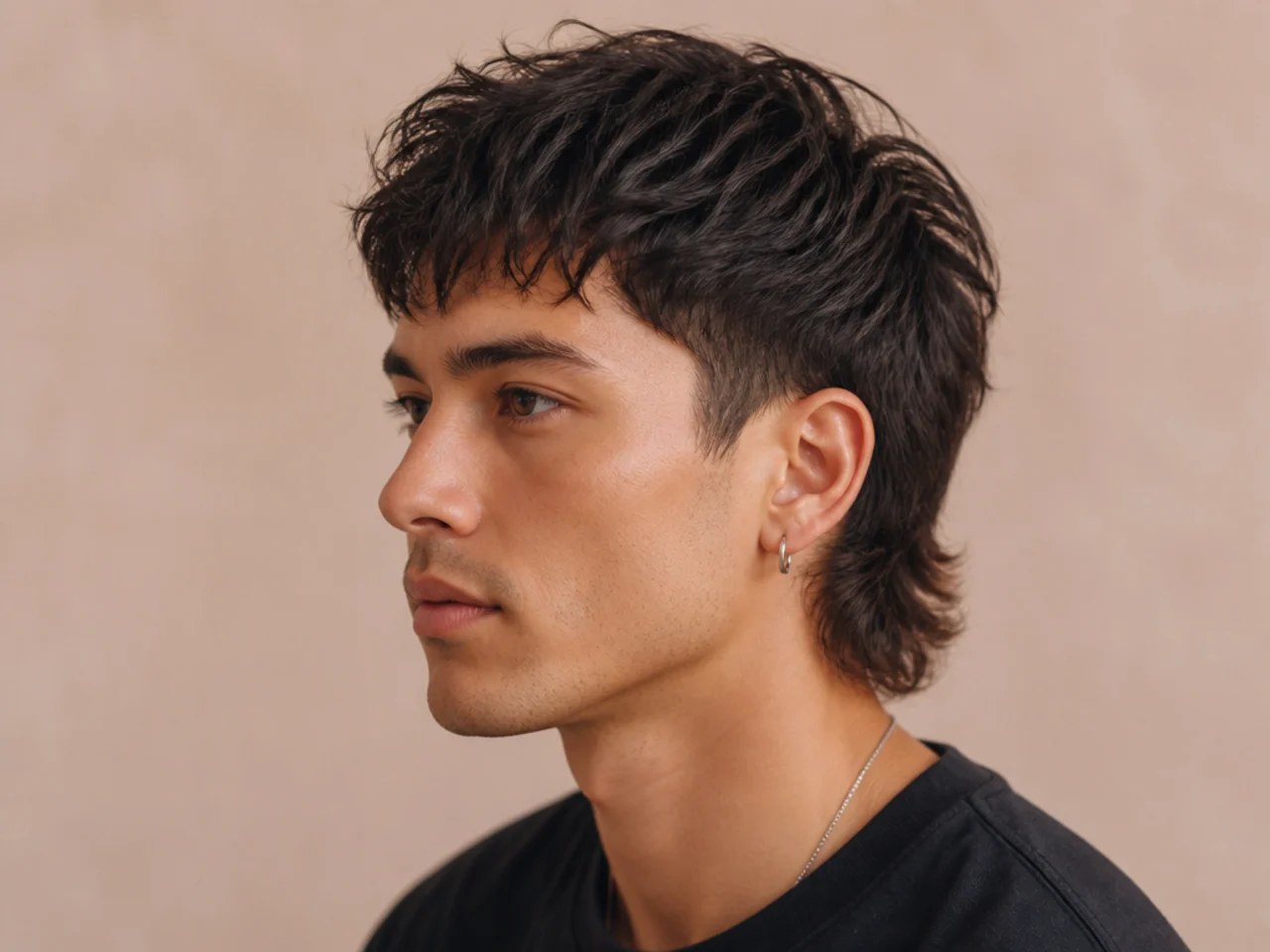 Short soft mullet with two-inch top and clean feathered nape at the collar