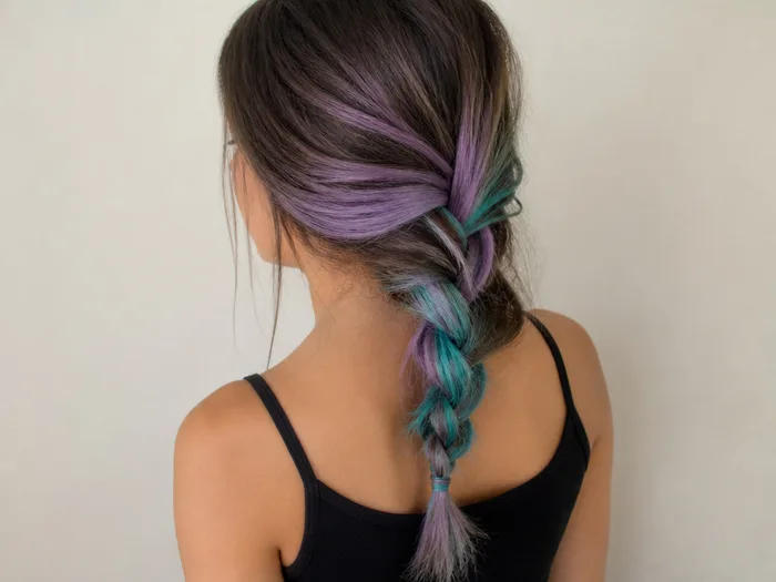 Mermaid braid Halloween hairstyle with temporary purple and green color