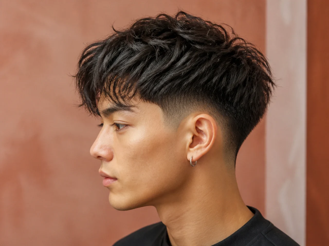 Textured two block with a mid fade starting at the temple showing bold contrast between top and skin