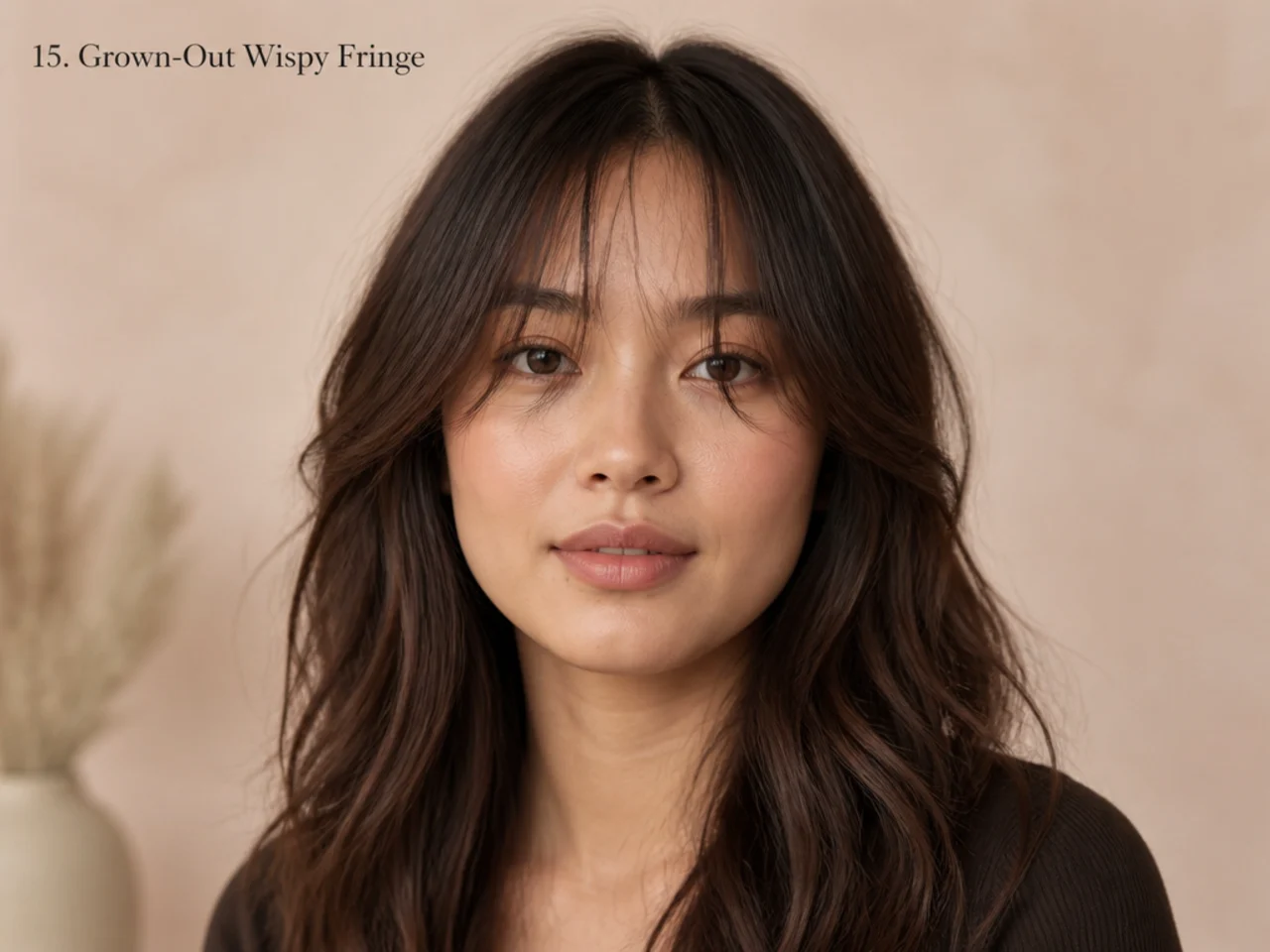 A grown-out wispy fringe