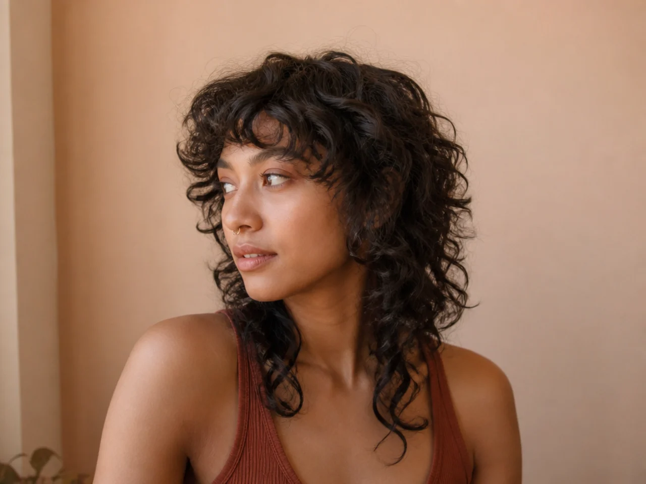 An air dried curly wolf cut with defined clumps