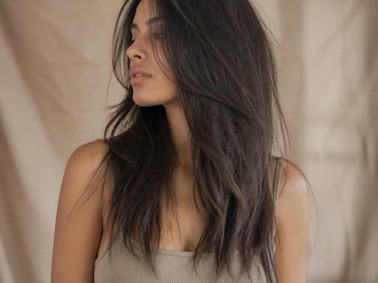 Long hair showing thinned tapering ends after over layering