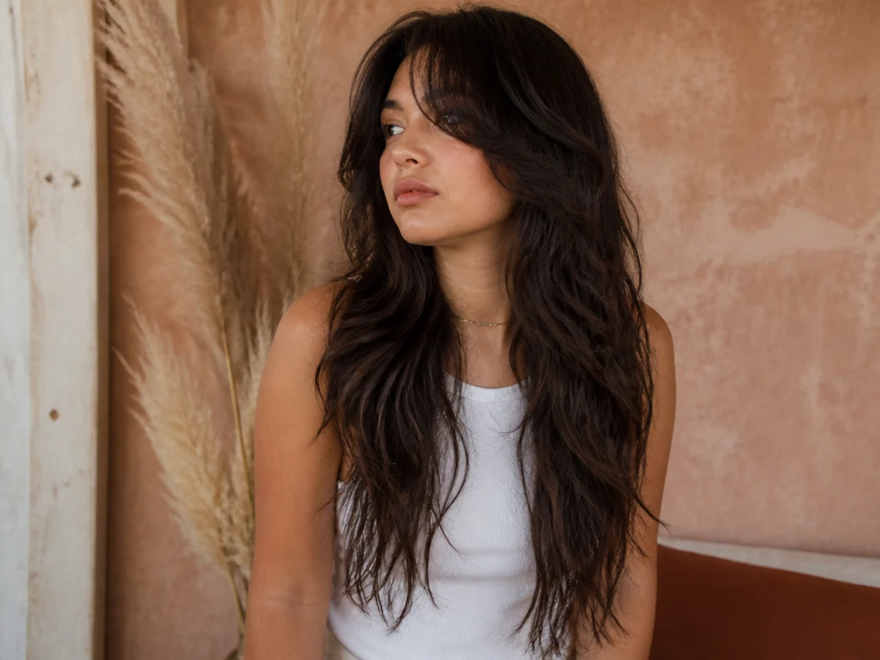 A waist length wolf cut on thick hair