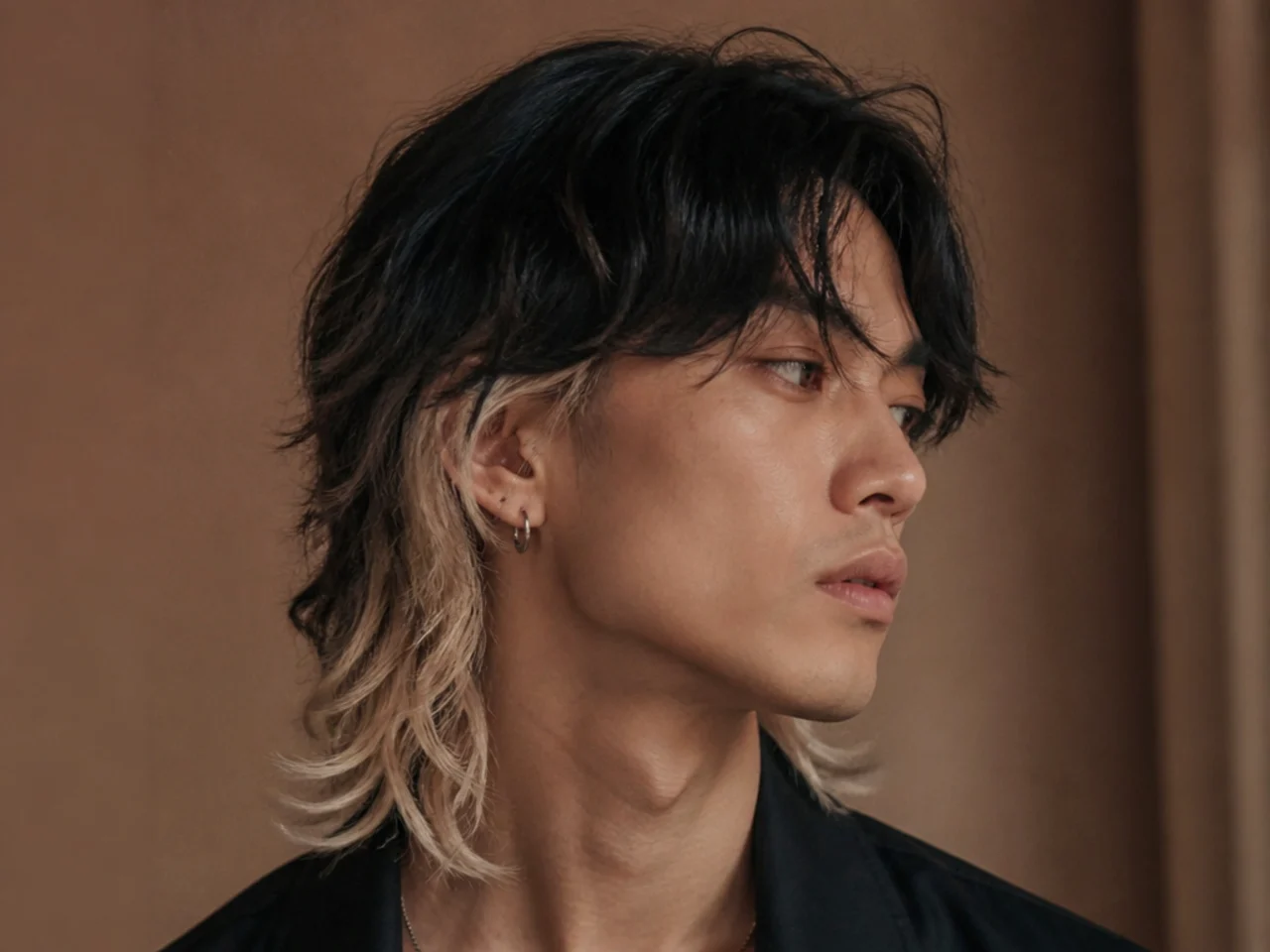 A mens wolf cut with bleached ends