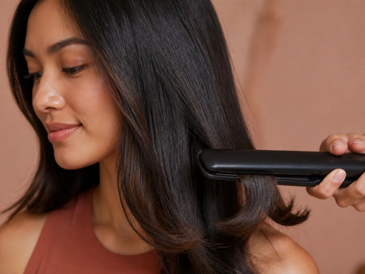 A flat iron bending the last two centimetres of hair outward