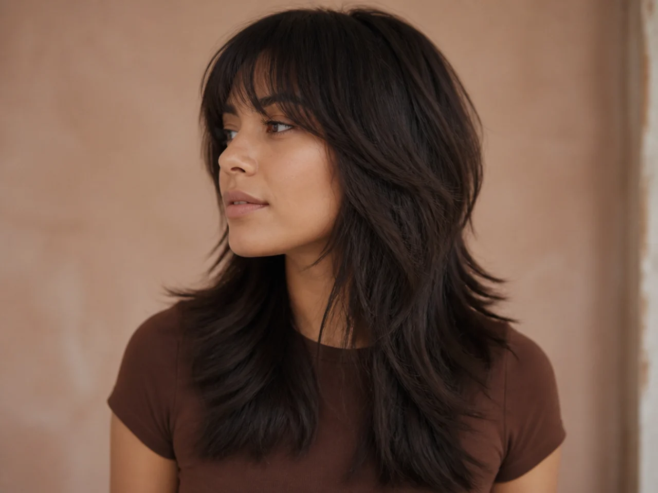A wolf cut with a layered interior and blunt cut ends