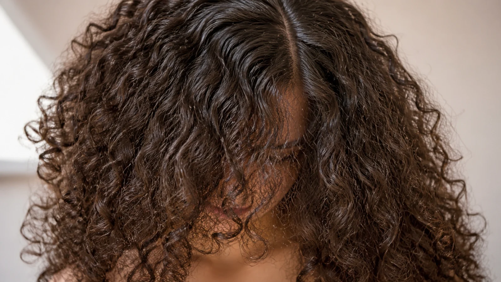 A wide cloud of curls parted down the middle