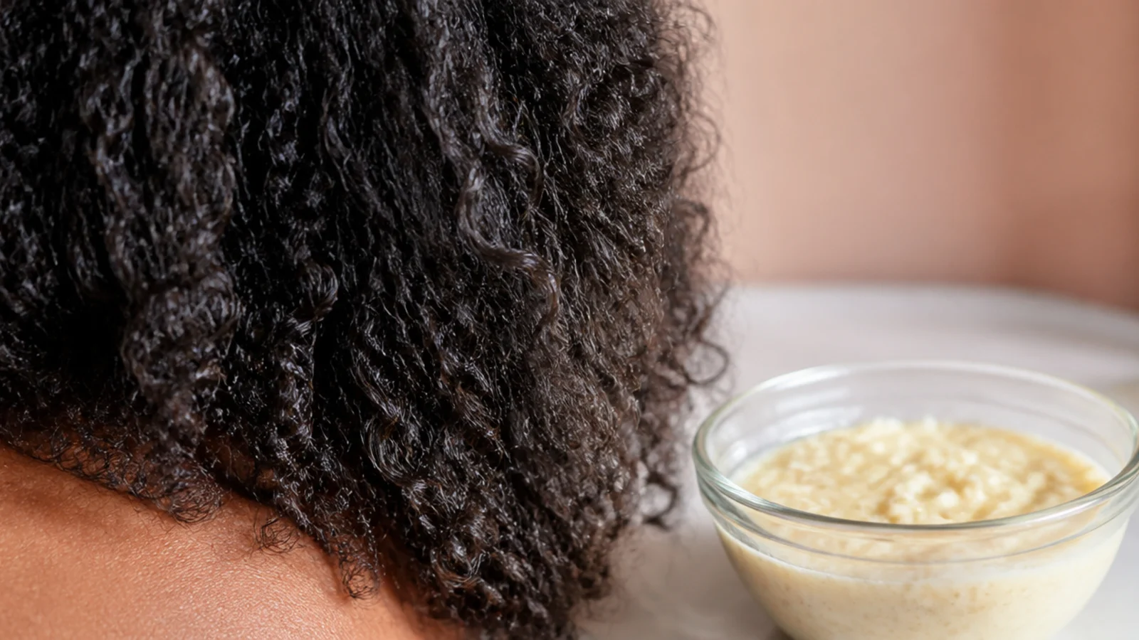 A smooth pale mask blended in a bowl with a spoon