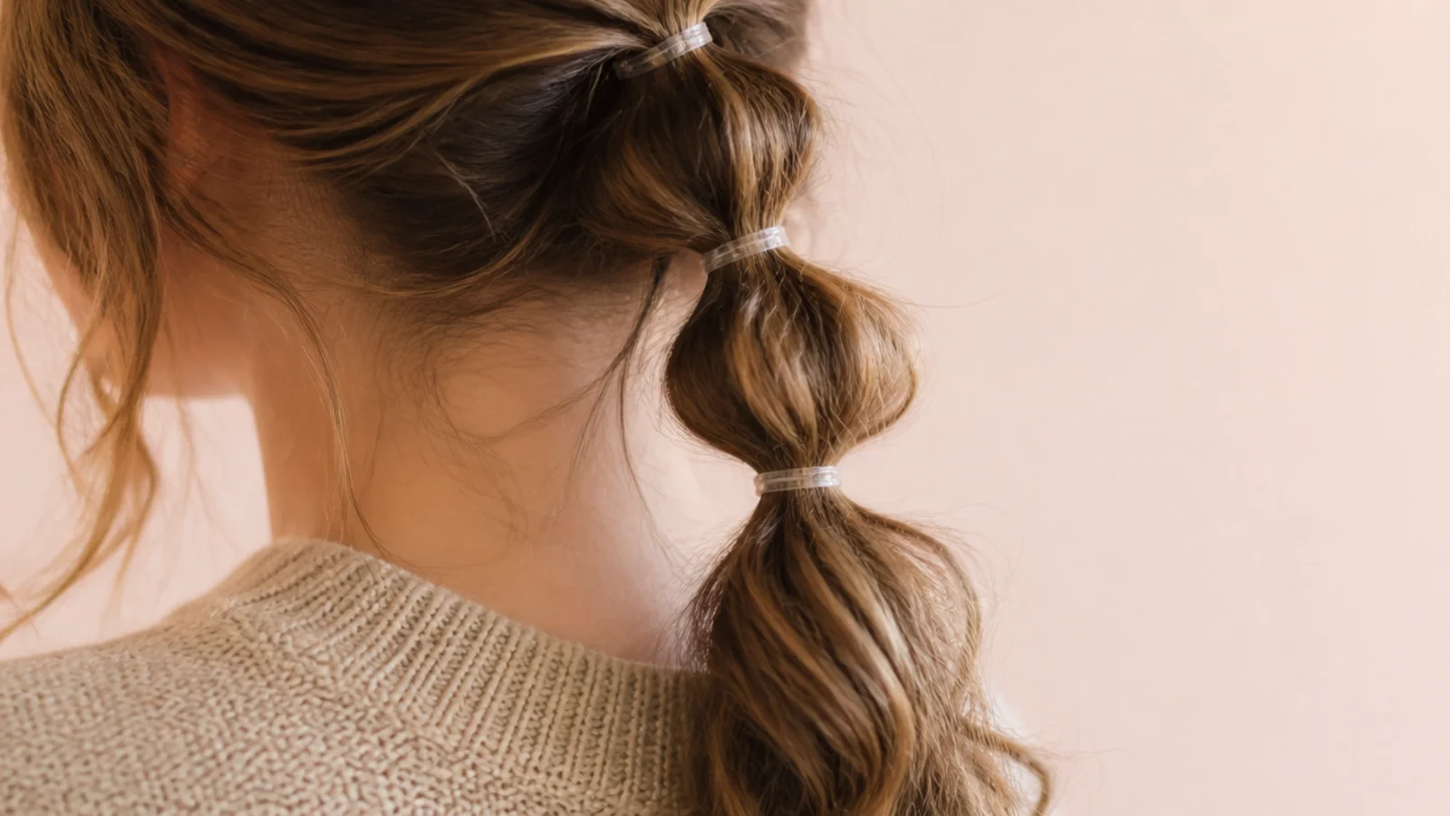 A ponytail sectioned into evenly spaced rounded bubbles