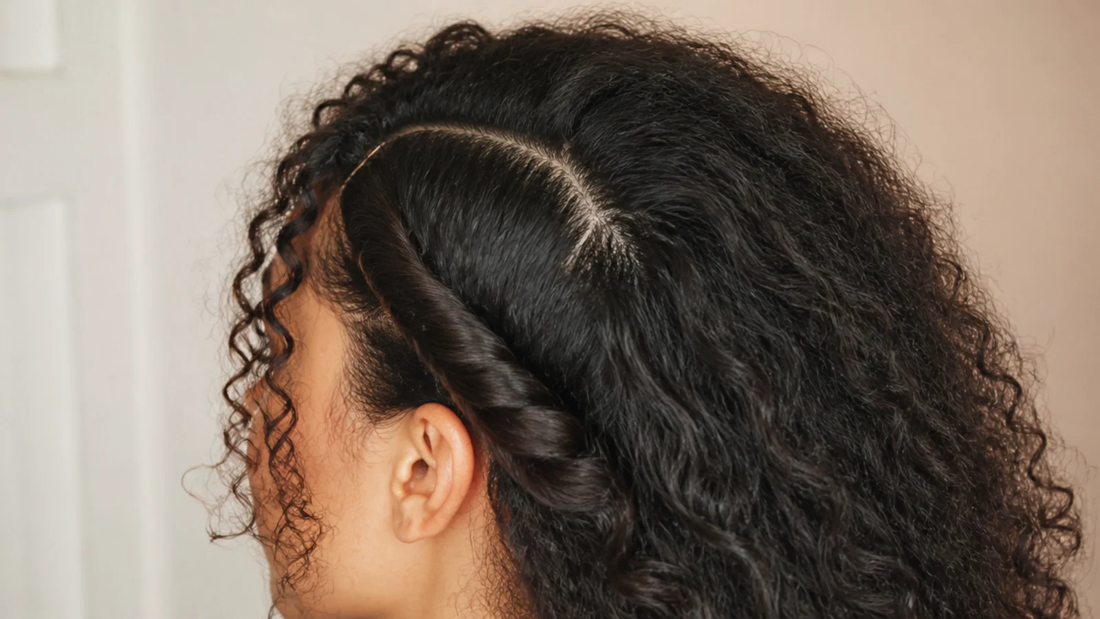 A deep side part with the heavier side twisted back and pinned