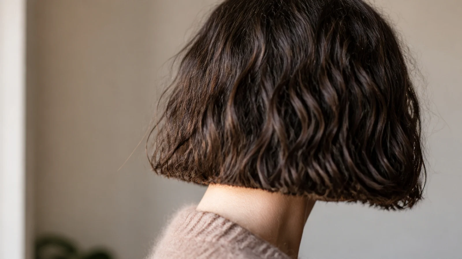 A blunt chin length bob on thick hair viewed from the front