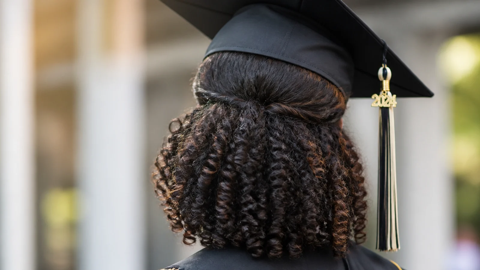 Curls gathered into a rounded puff with the rest left down