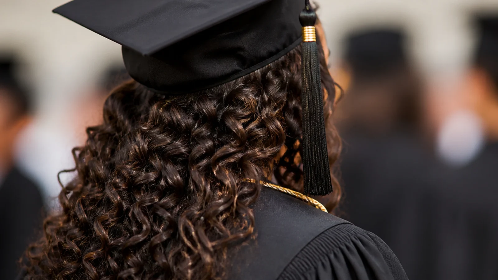Loose ringlets swept over one shoulder and pinned at the opposite side