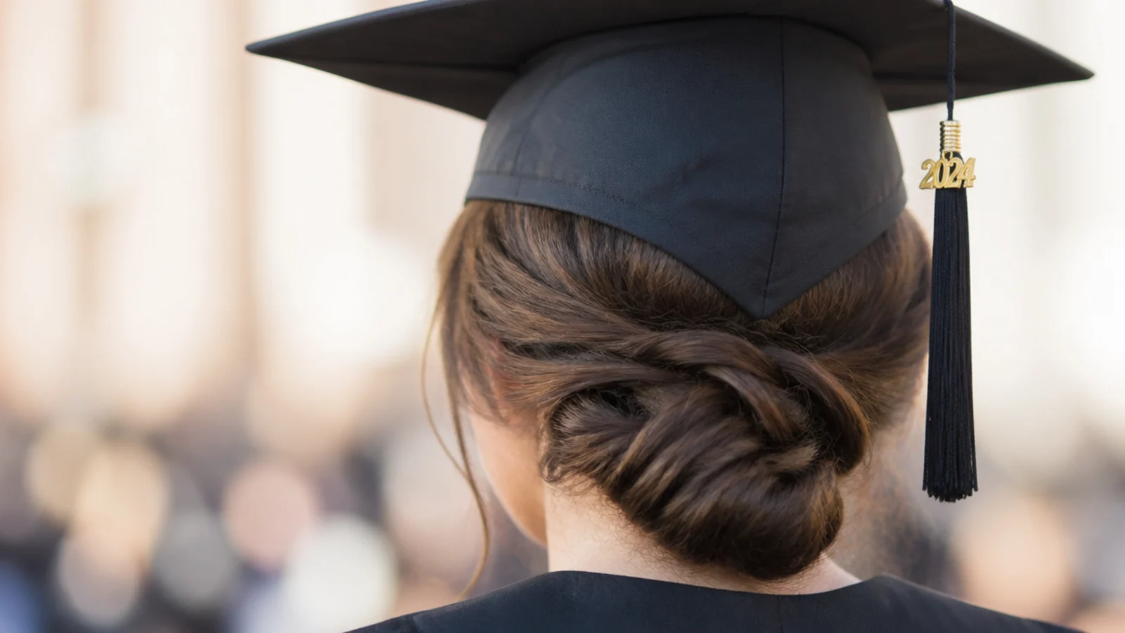 A smooth knot pinned low at the back of the neck