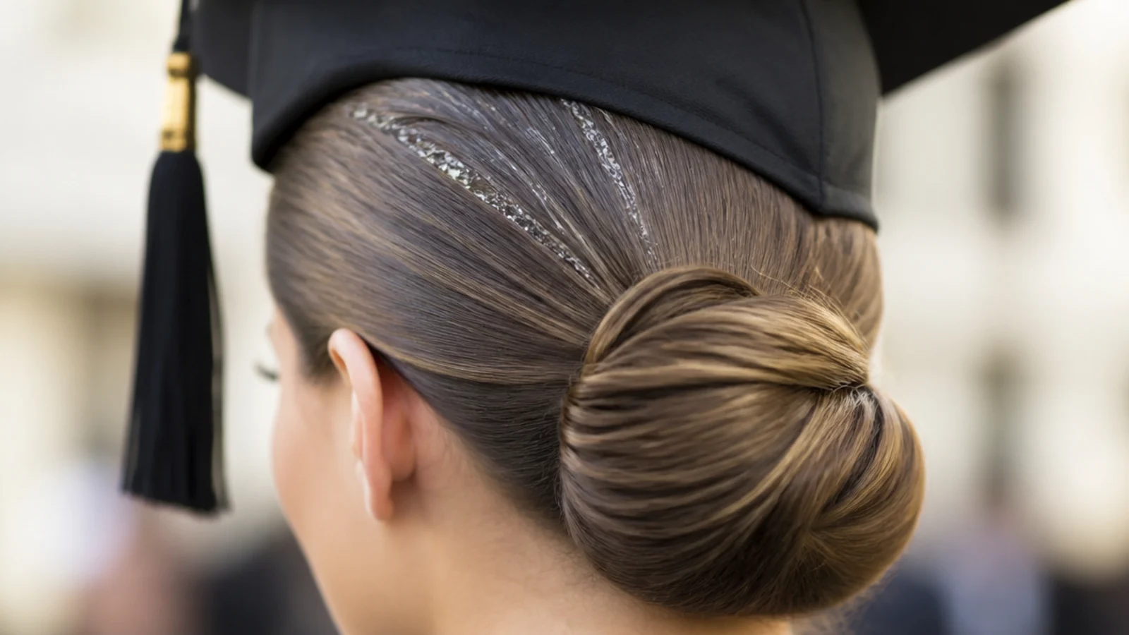 Hair gelled flat to the scalp and gathered into a small bun