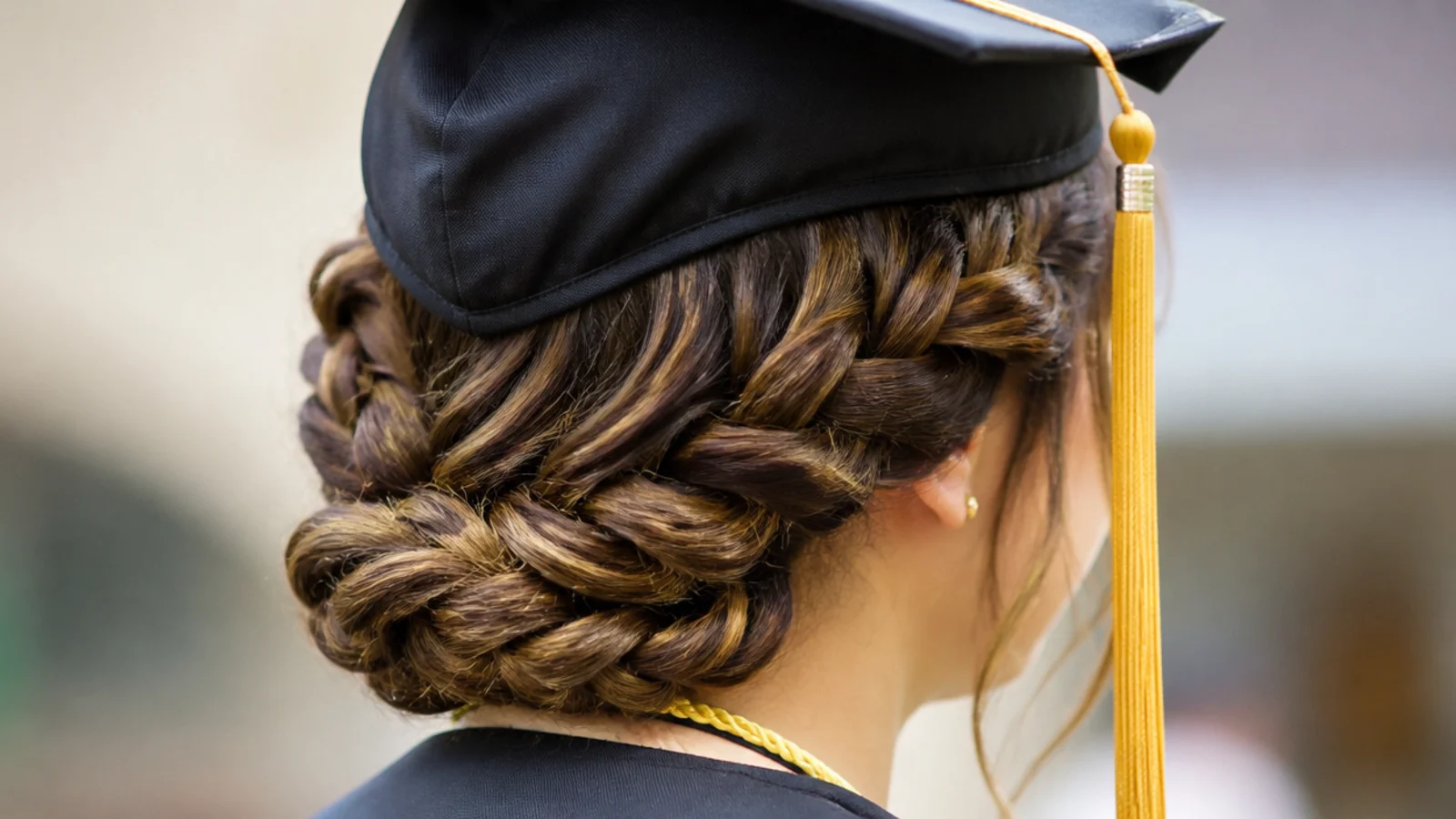 A braid wrapped low around the back of the head and pinned